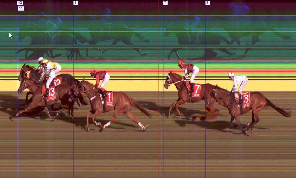 Photo finish shot of a horse race with mirrors and vertical lines to determine the winner