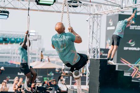 Three Ninja Parkour participants climbing ropes and completing obstacles