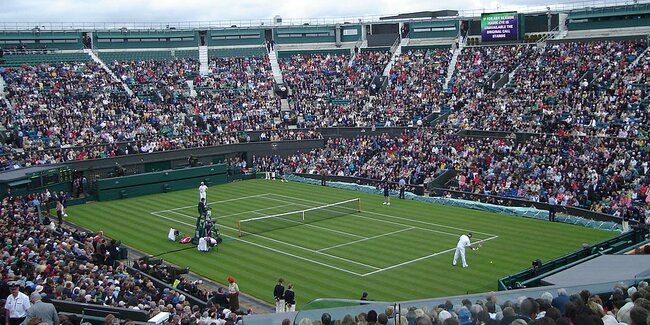 Tennis match with video wall in open stadium